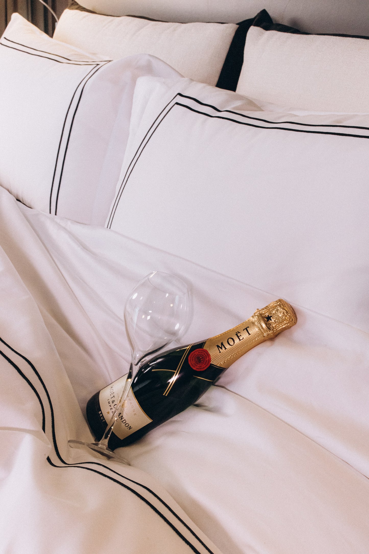 Luxury bed sheet 300TC. Moet champagne bottle.