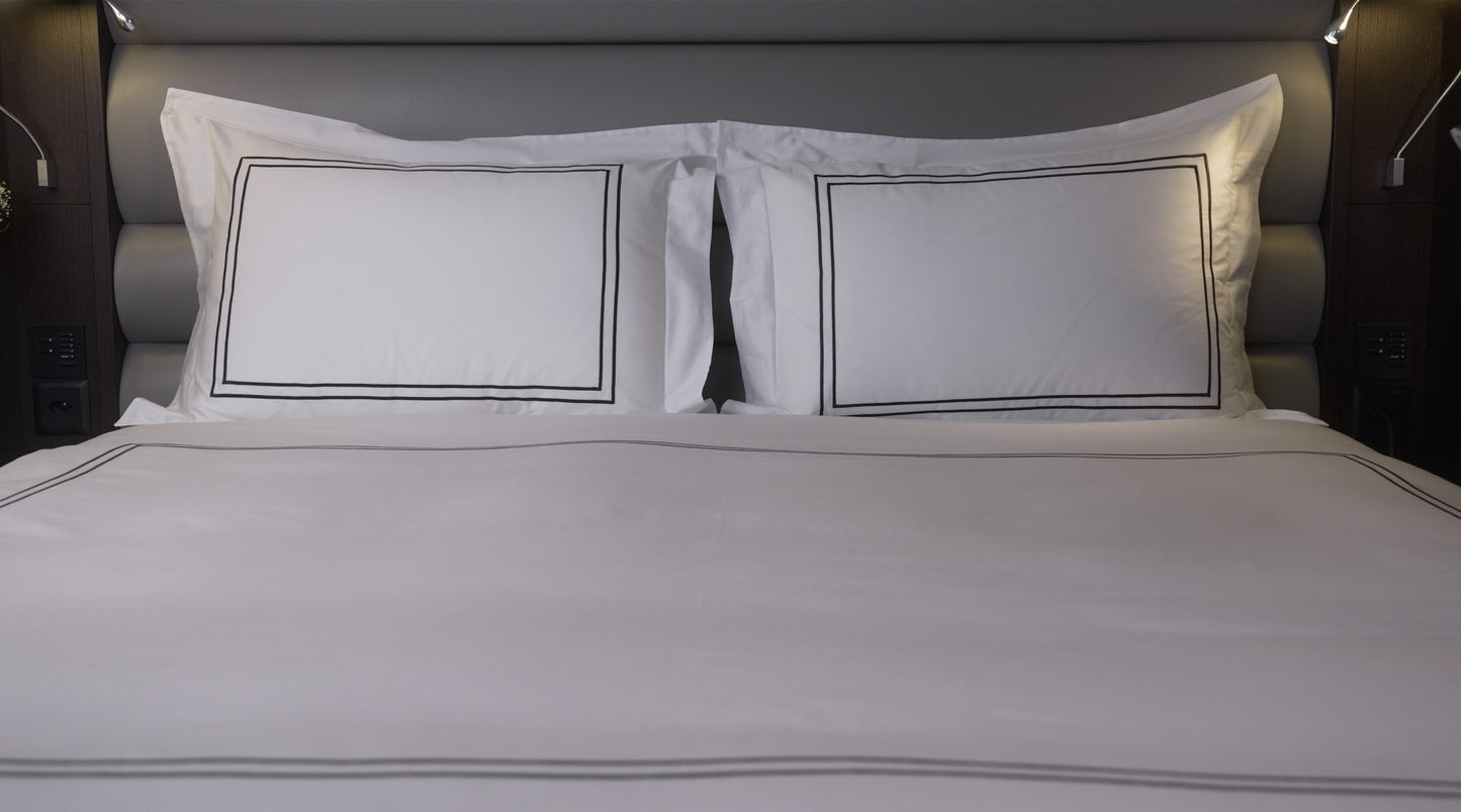 Luxury bed sheet 300TC. Bed made with pillowcase.