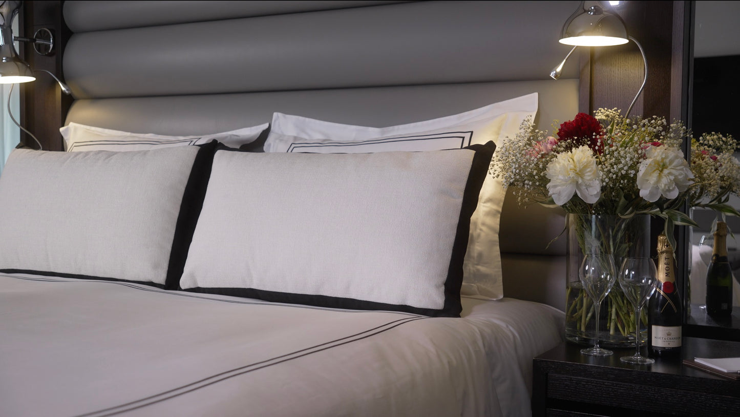 White and black decorative cushion.